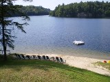 beach and pristine waters of otter lake, sunny point resort inn, waterfront inns parry sound